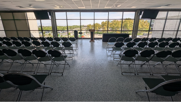 Presidential North event space showing rows of chairs with large windows overlooking UVU campus.